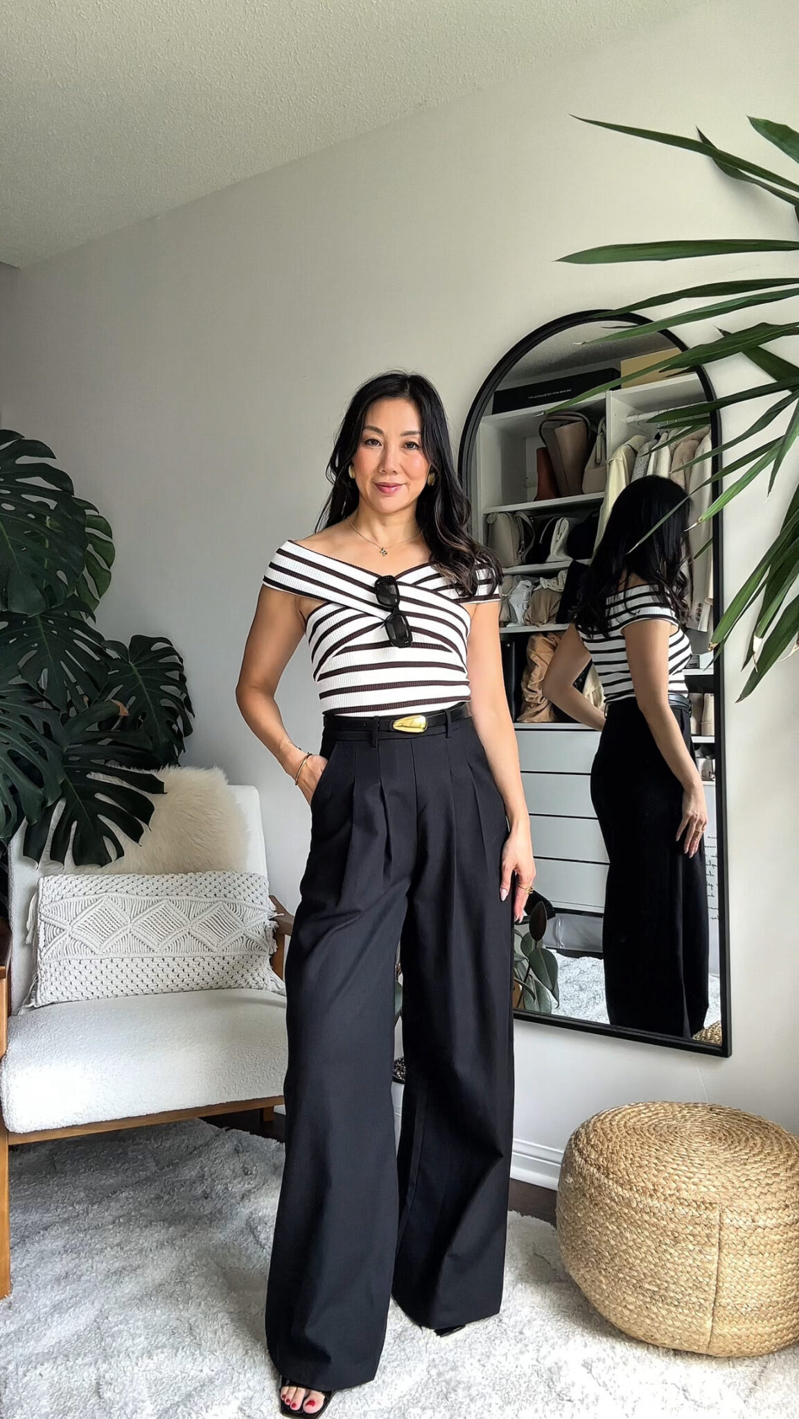 Striped button-down with black pants – casual, crisp neutral look