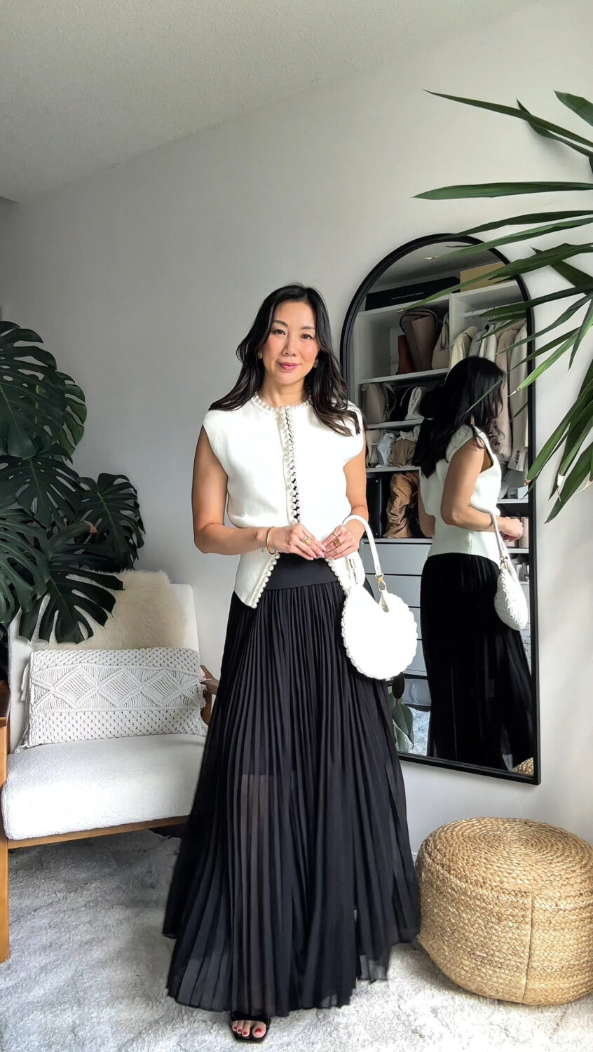 Knit beaded cardigan and  black pleated maxi skirt. 